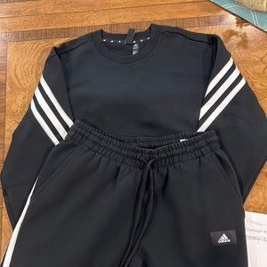 Adidas sweat suit.